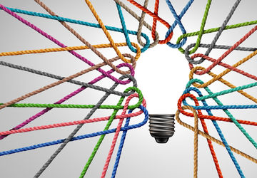 thinking team stock image of light bulb and woven threads