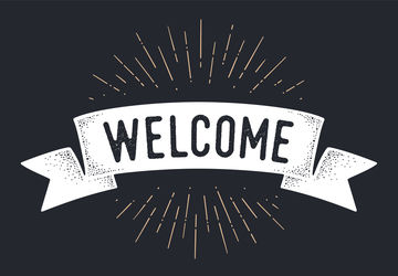 The world "welcome" on a chalkboard background